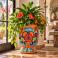 Mexican Talavera planter (TCTP540) planted with a mix of greenery and colorful flowers.
