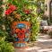 Mexican Talavera planter (TCTP540) styled with lush greenery and flowering plants.