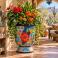 Mexican Talavera planter (TCTP550) planted with a mix of greenery and colorful flowers.