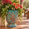 Mexican Talavera planter (TCTP560) planted with a mix of greenery and colorful flowers.