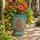 Mexican Talavera planter (TCTP560) styled with lush greenery and flowering plants.