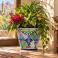 Mexican Talavera planter (TP435) displayed with green foliage and colorful flowers.