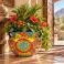 Large Mexican Talavera planter (TP250A) styled with lush greenery and flowering plants.