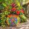 Hand-painted large Mexican Talavera planter (TP245A) displayed with lush greenery and flowers.