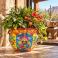 Large Mexican Talavera planter (TP245A) styled with lush greenery and flowering plants.